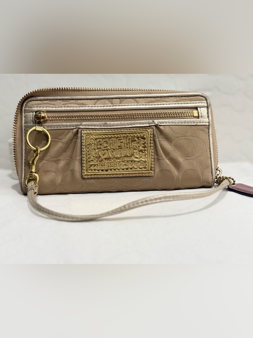Coach Beige Poppy Wristlet with Gold Plaque